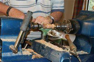 Turning a bottle stopper. Heath Robinson system